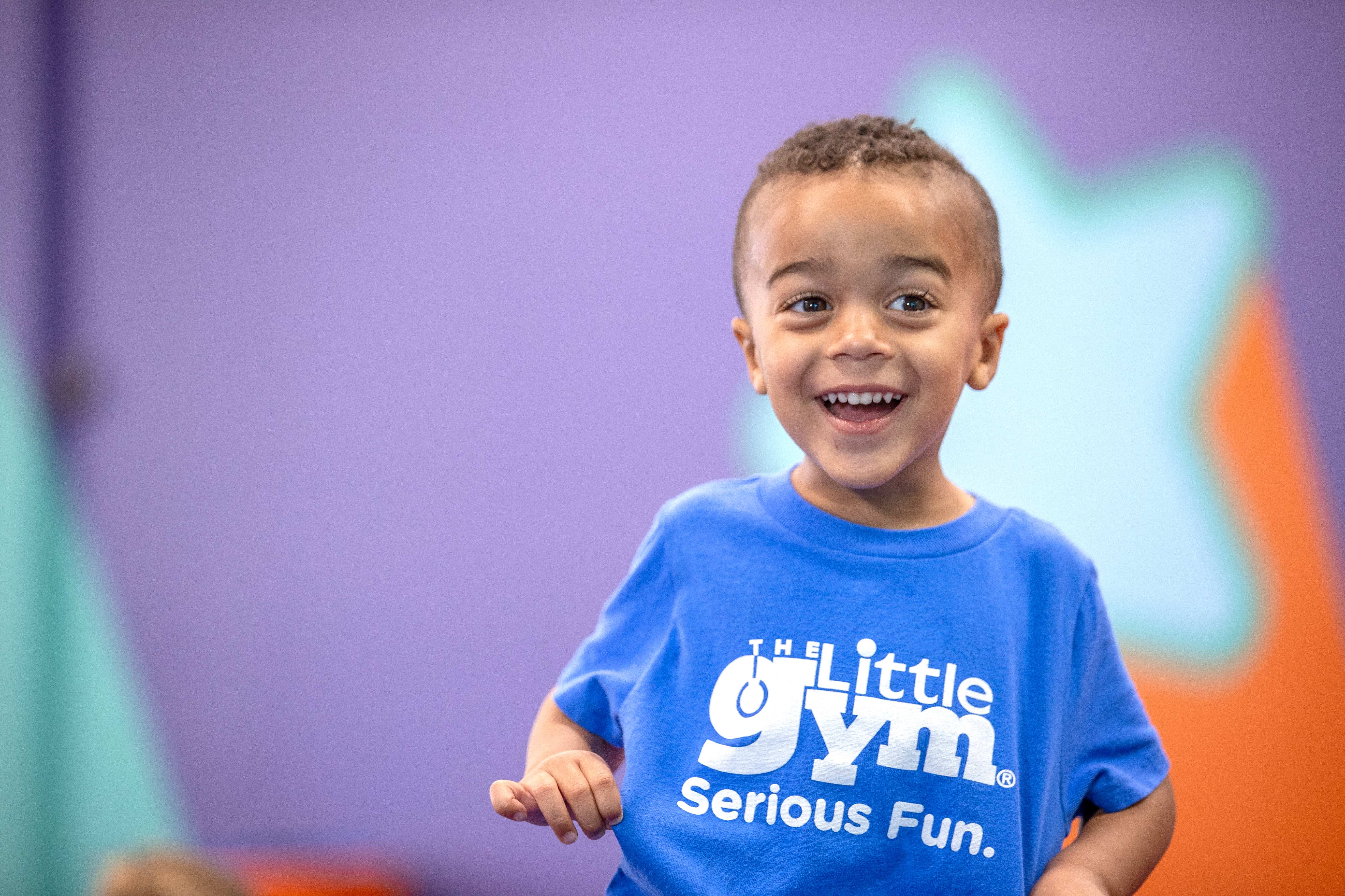 The Little Gym member smiling in class